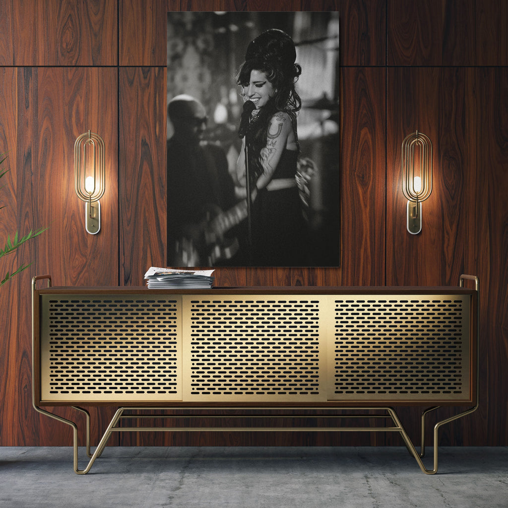 Sleek aluminum black and white metal print of Amy Winehouse displayed over a mid-century modern credenza.