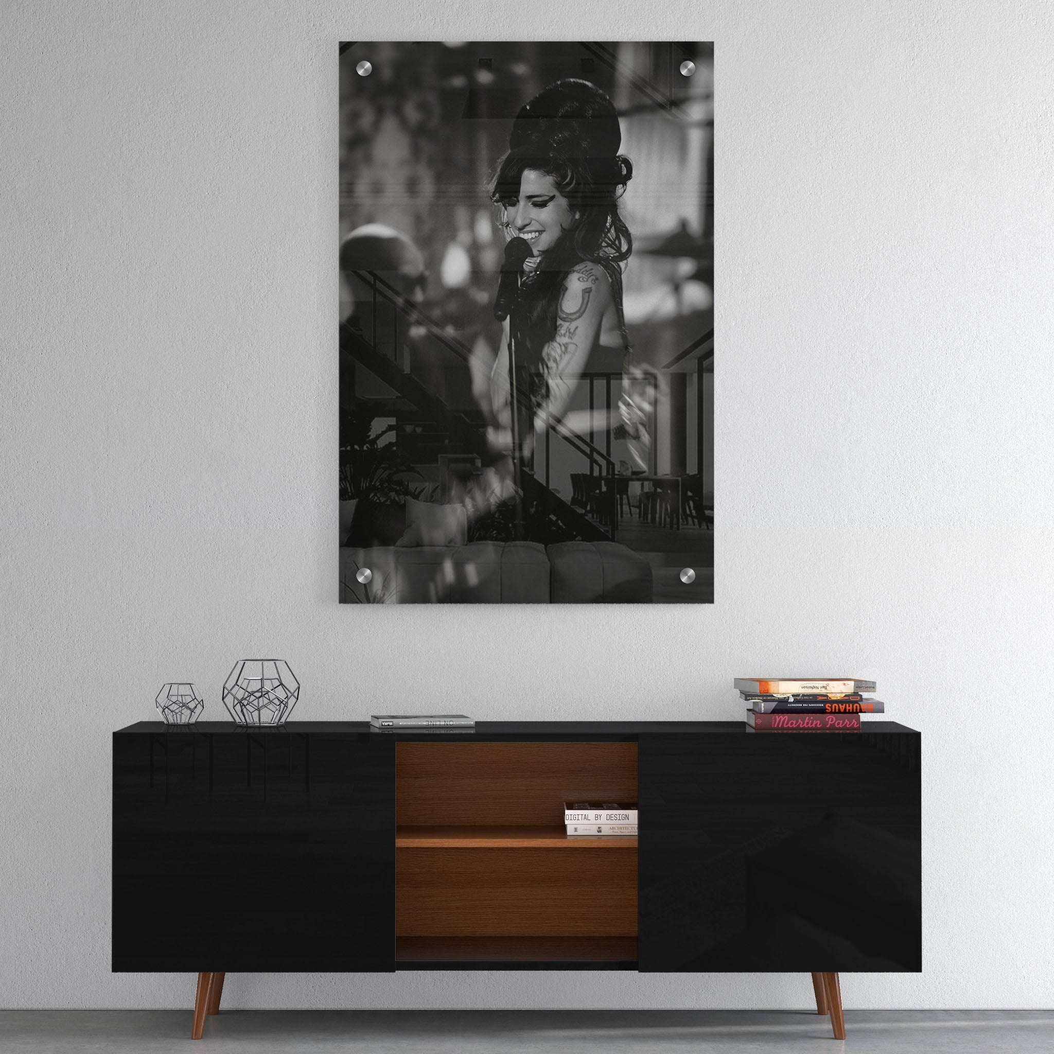 High-gloss acrylic glass black and white print of Amy Winehouse displayed above a contemporary console.