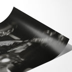 Angled close-up of the unframed premium matte black and white Amy Winehouse 2008 Grammys poster print.