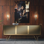 Sleek aluminum color metal print of Amy Winehouse displayed over a mid-century modern credenza.