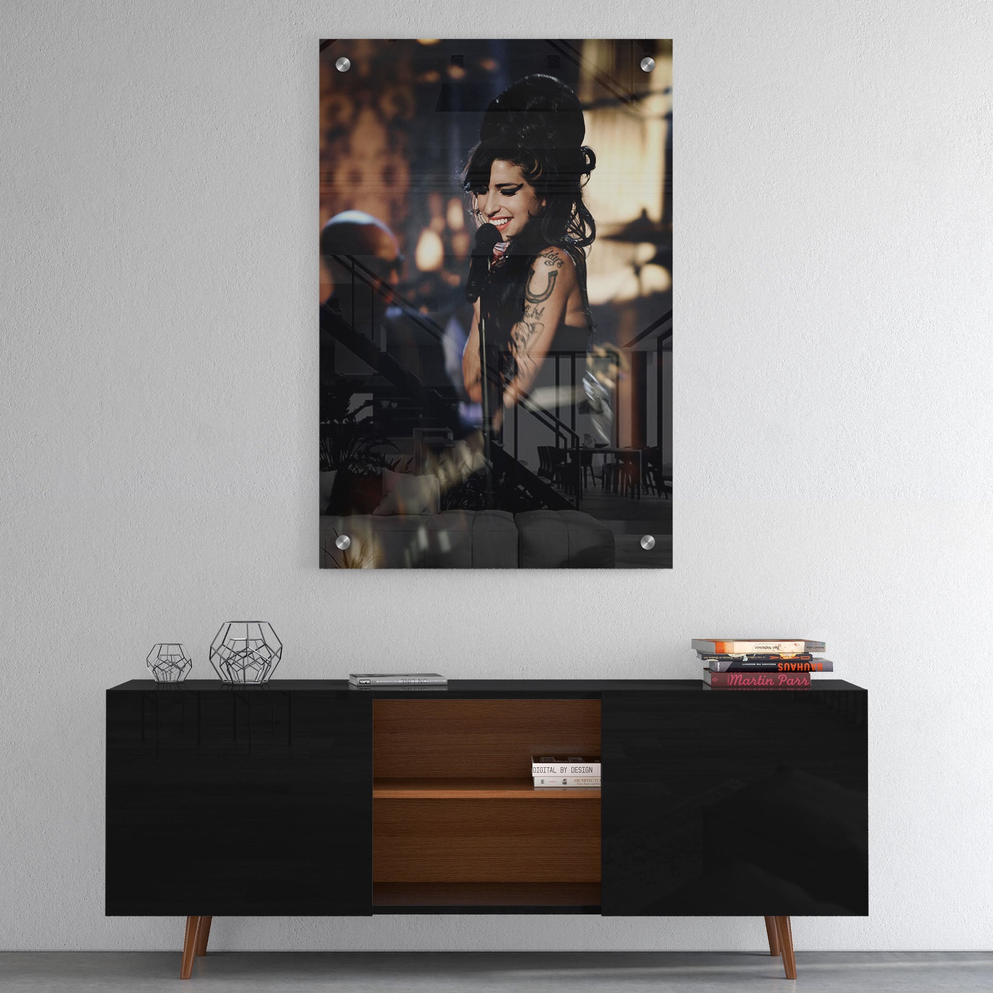 High-gloss acrylic glass color print of Amy Winehouse displayed above a contemporary console.