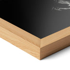 Corner close-up highlighting the natural oak finish of the framed David Bowie 1976 black and white poster.