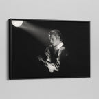 Side angle of the David Bowie 1976 black and white canvas in a luxury minimalist black floating frame.
