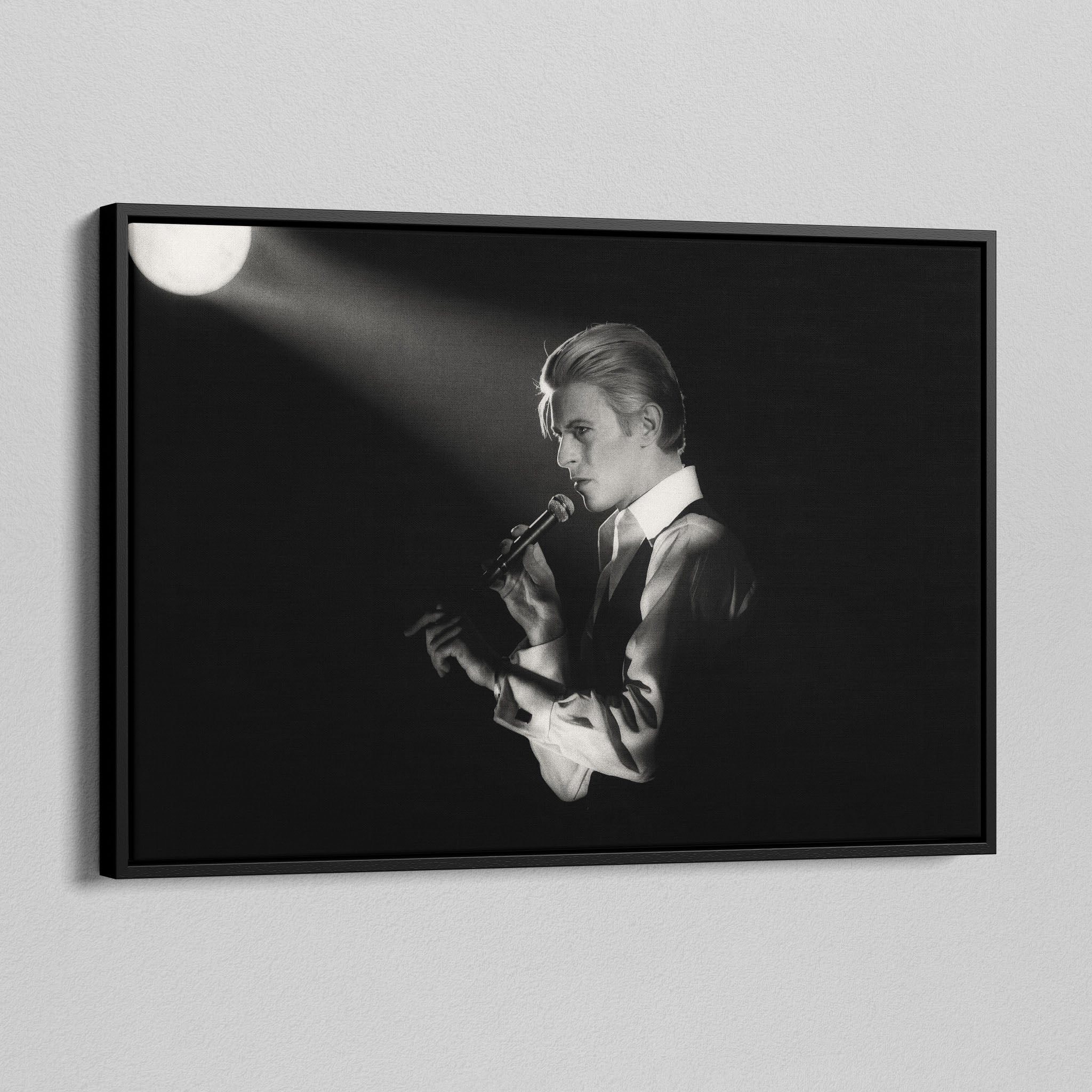 Side angle of the David Bowie 1976 black and white canvas in a luxury minimalist black floating frame.