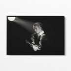 Front view of the David Bowie 1976 black and white canvas in a sleek black floating frame.