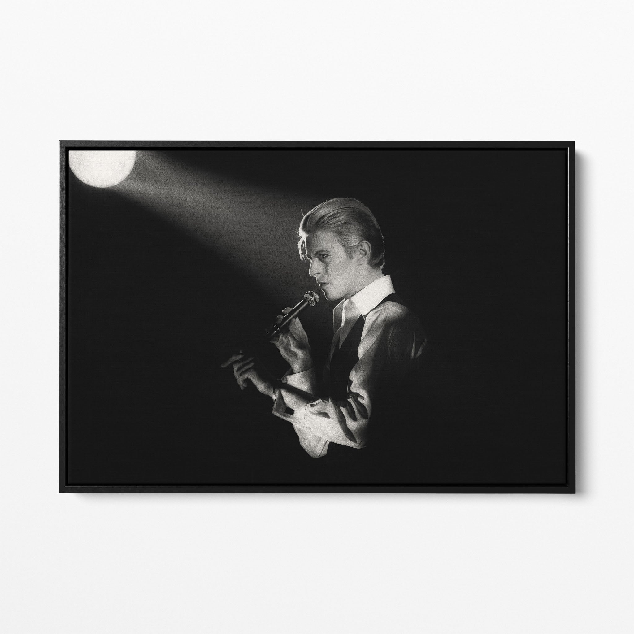 Front view of the David Bowie 1976 black and white canvas in a sleek black floating frame.