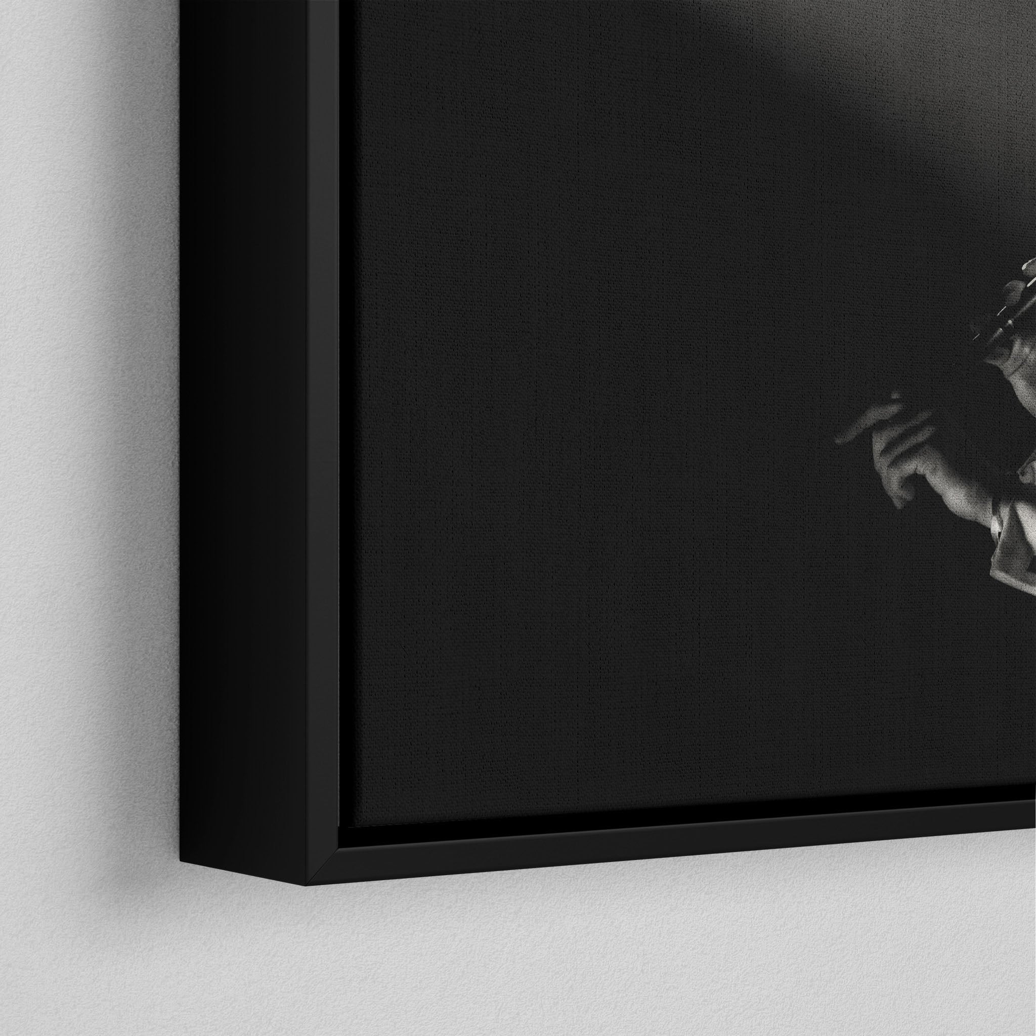 Corner macro of the elegant floating gap and fine finish of the black floating canvas frame.