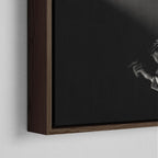 Corner close-up showing the rich grain and joinery of the dark walnut floating canvas frame.
