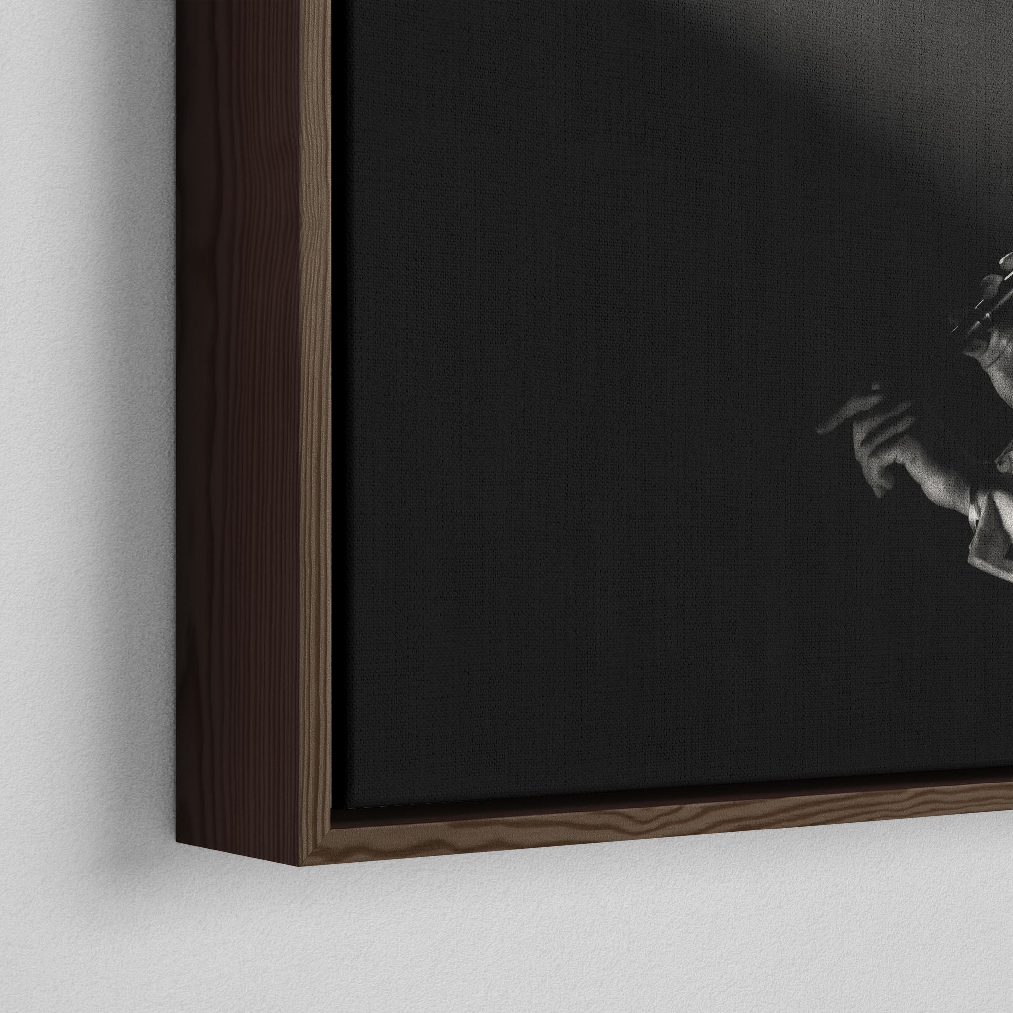 Corner close-up showing the rich grain and joinery of the dark walnut floating canvas frame.