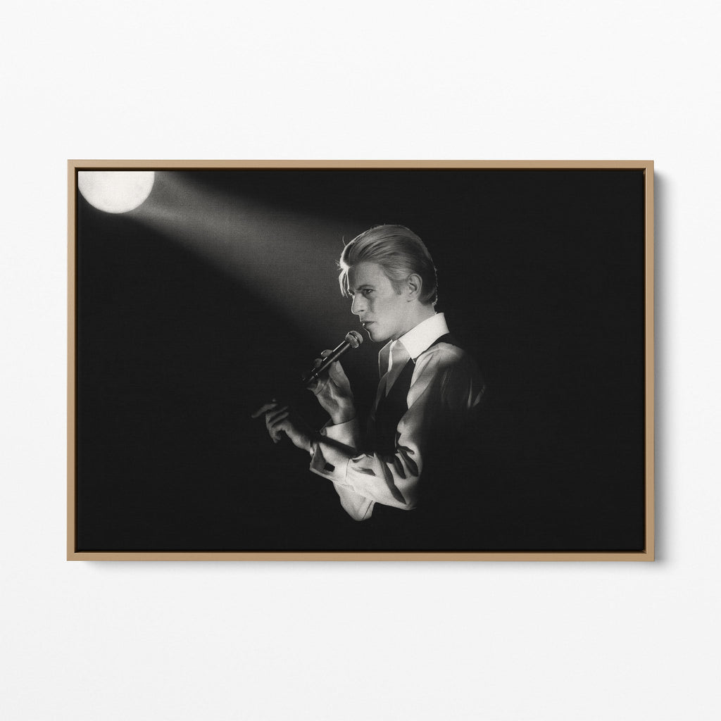 Front display of the David Bowie 1976 black and white canvas in a premium natural wood floating frame.