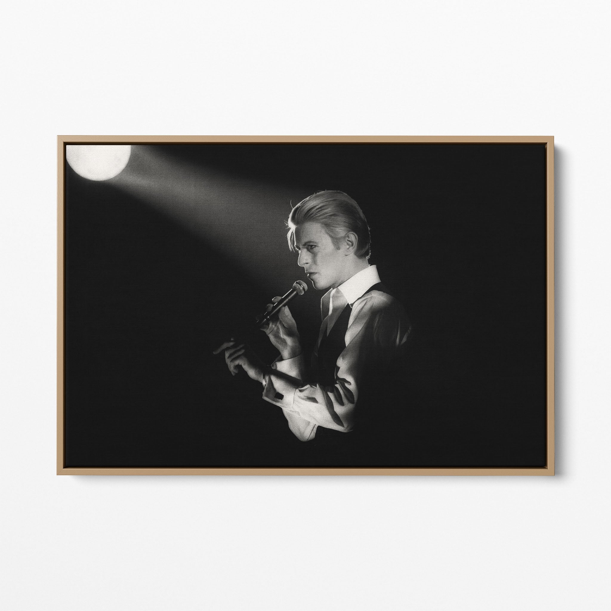 Front display of the David Bowie 1976 black and white canvas in a premium natural wood floating frame.
