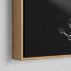 Corner close-up of the floating gap and grain texture of the natural wood canvas frame.