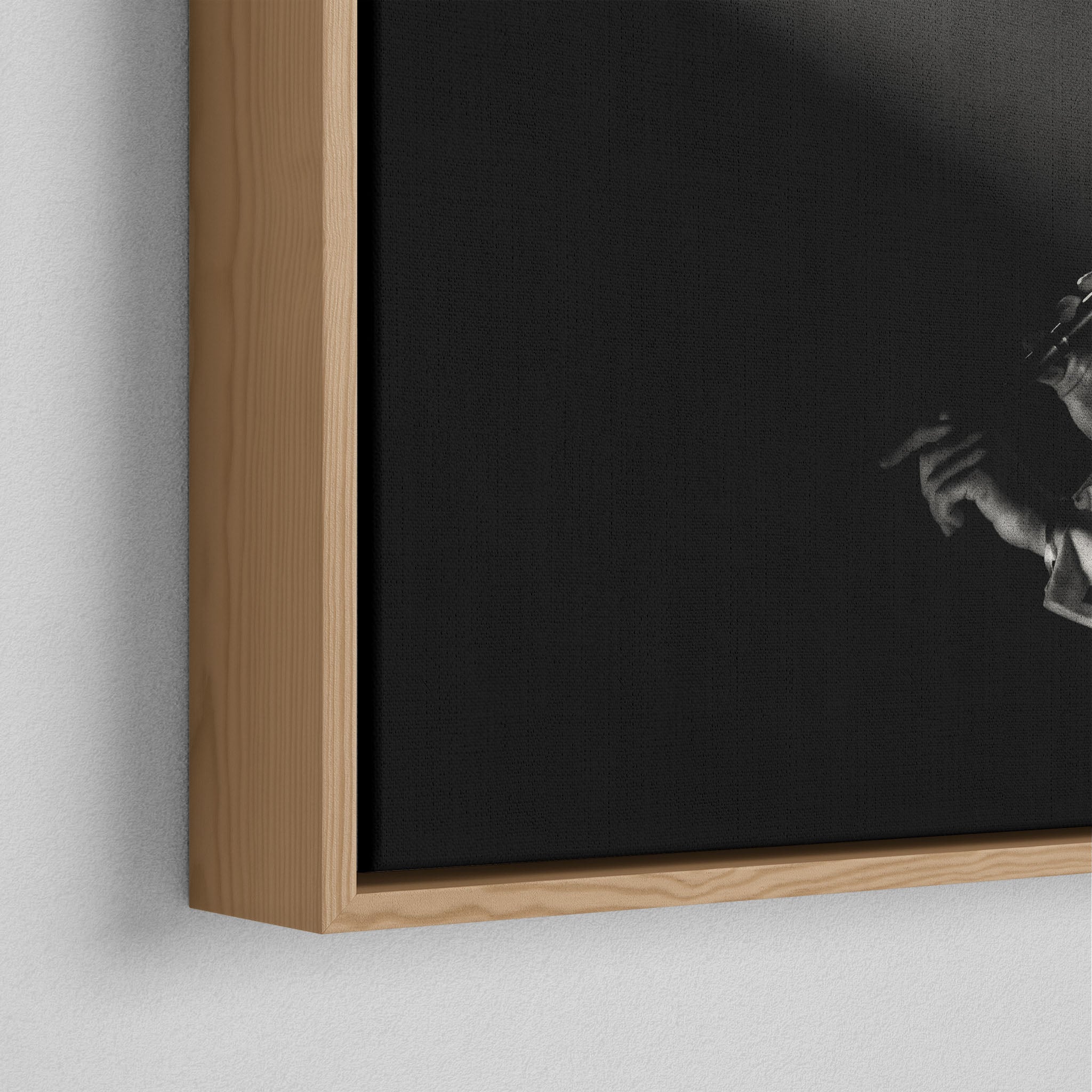 Corner close-up of the floating gap and grain texture of the natural wood canvas frame.