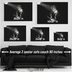 David Bowie 1976 Isolar Tour black and white wall art size comparison chart shown above an average 90-inch three-seater sofa.