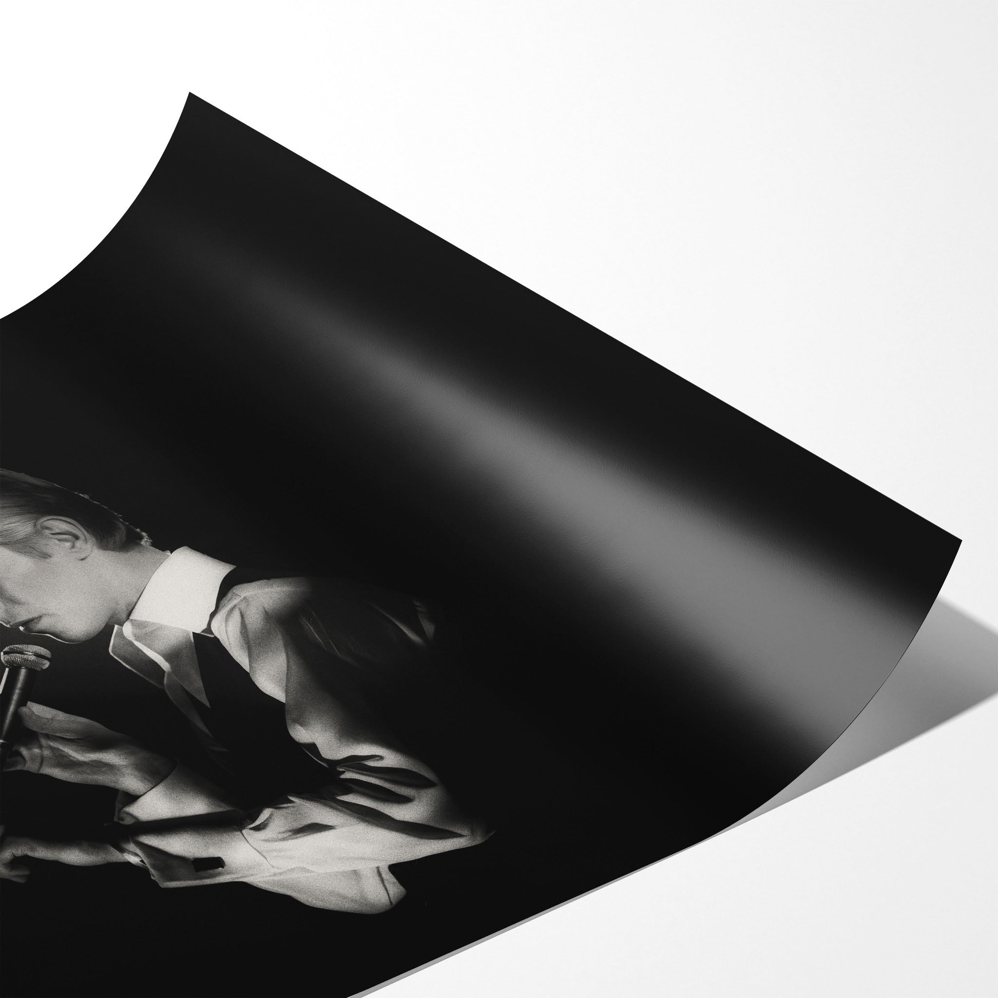 Angled close-up of the unframed premium matte black and white David Bowie 1976 poster print.