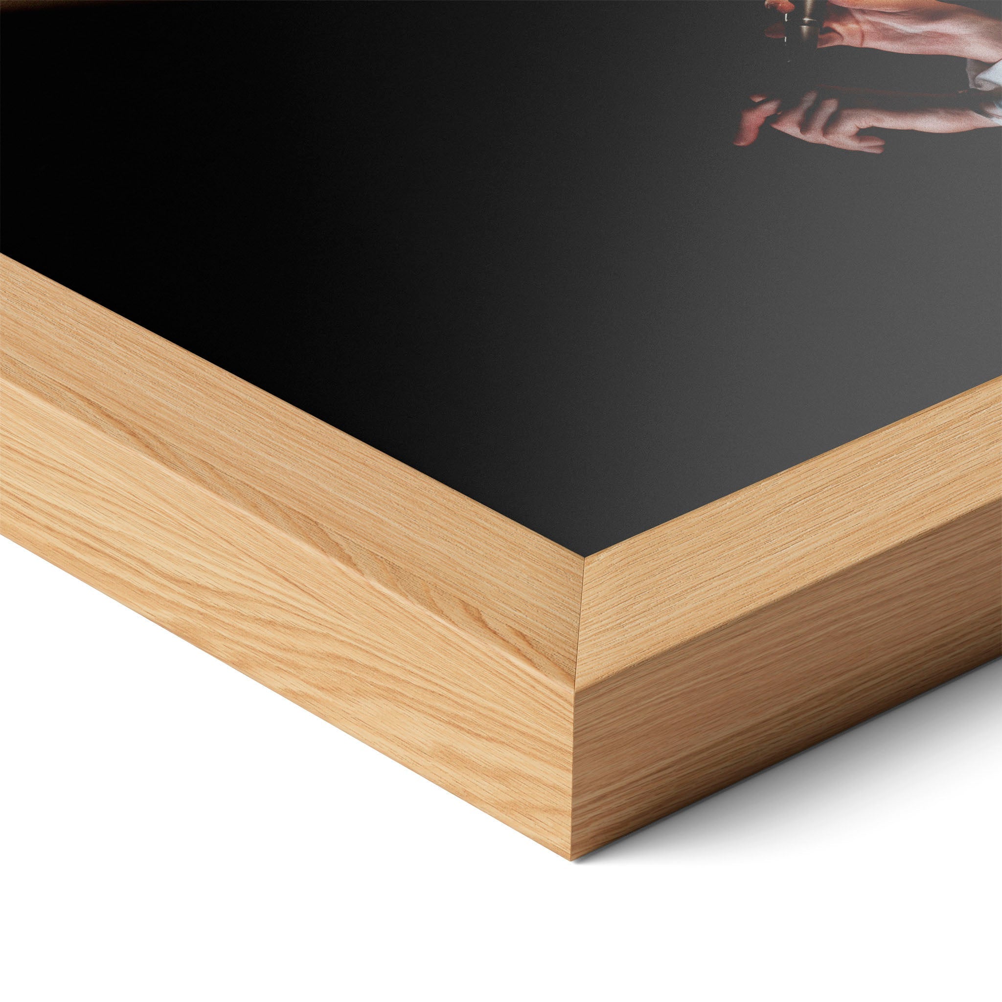 Corner close-up highlighting the natural oak finish of the framed David Bowie 1976 colorized poster.