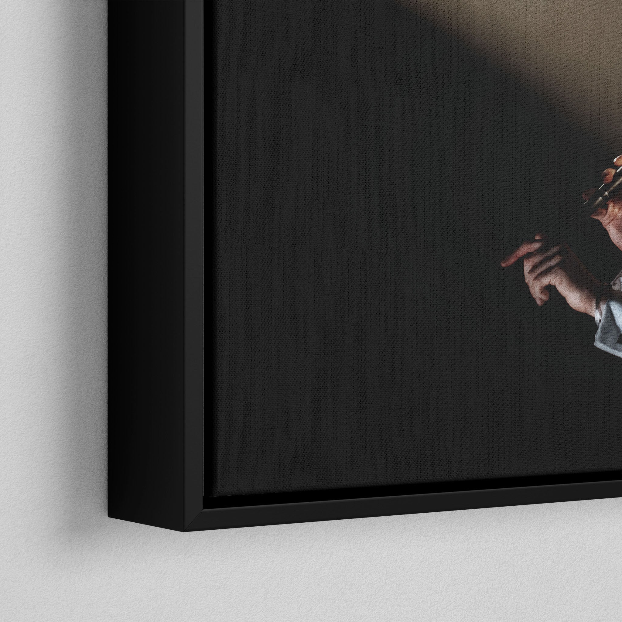 Corner macro of the elegant floating gap and fine finish of the black floating canvas frame.