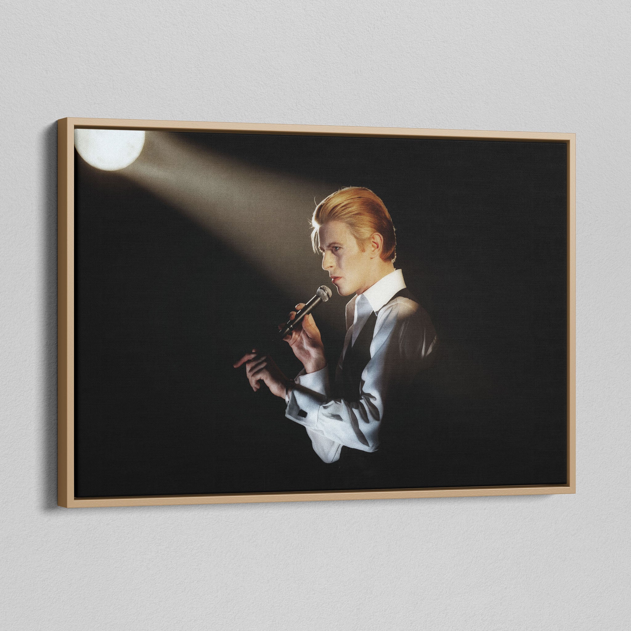 Angled view of the colorized canvas in a modern natural oak wood floating frame.