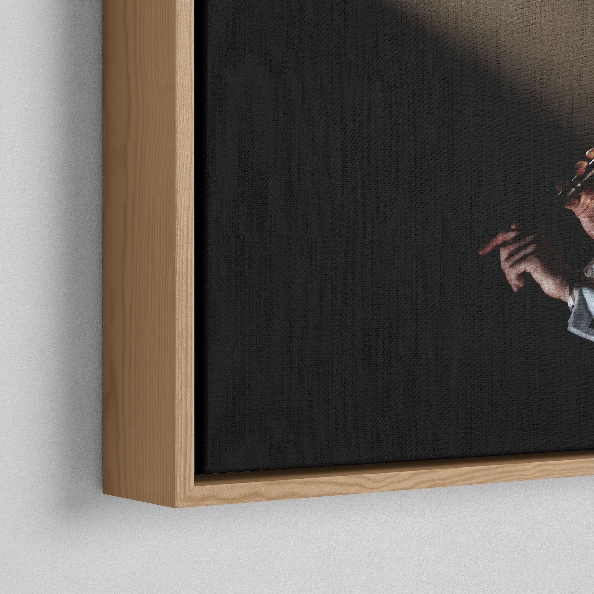 Corner close-up of the floating gap and grain texture of the natural wood canvas frame.