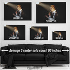David Bowie 1976 Isolar Tour colorized wall art size comparison chart shown above an average 90-inch three-seater sofa.