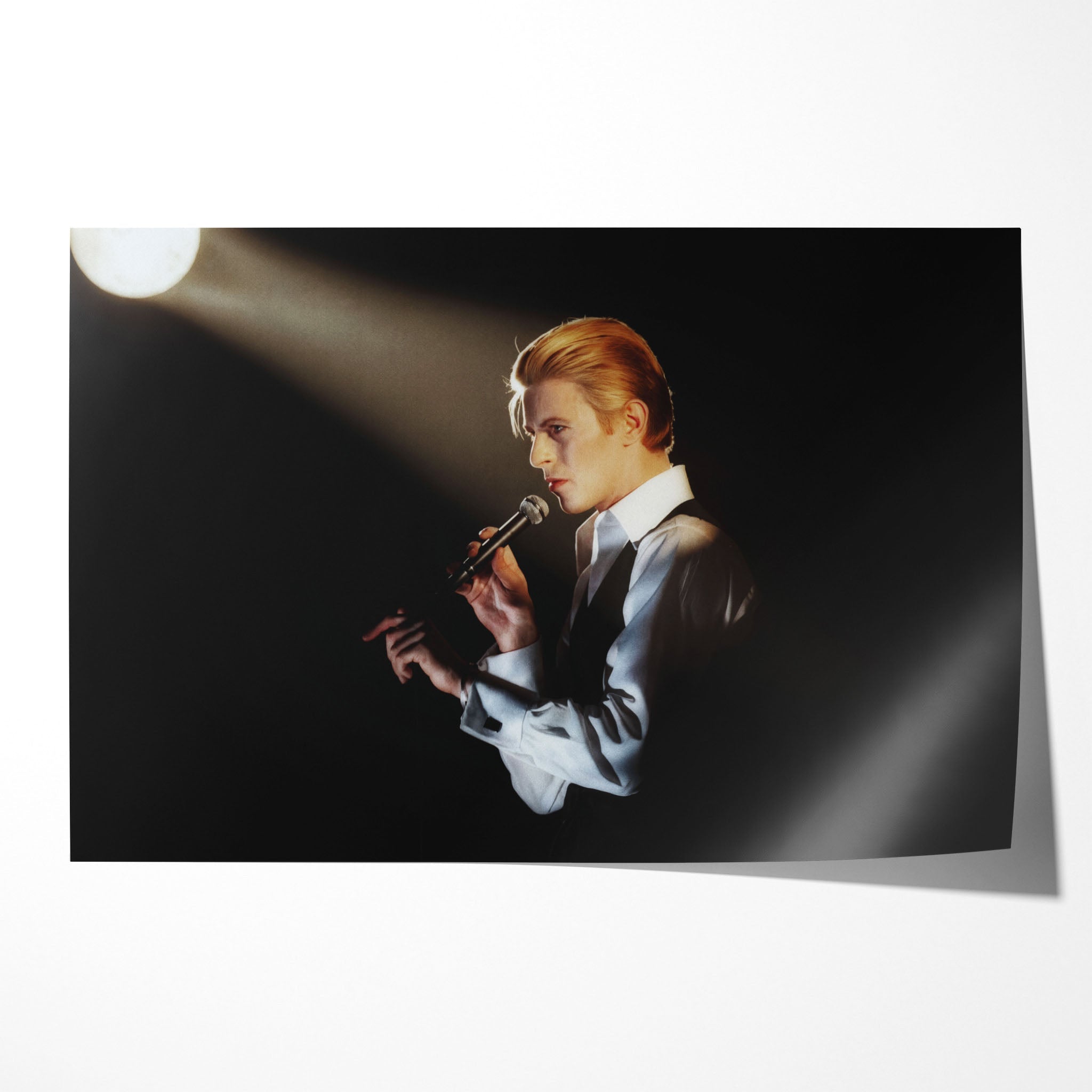 Unframed colour-enhanced David Bowie Golden Duke 1976 Isolar Tour profile poster print, golden hair under a warm spotlight.