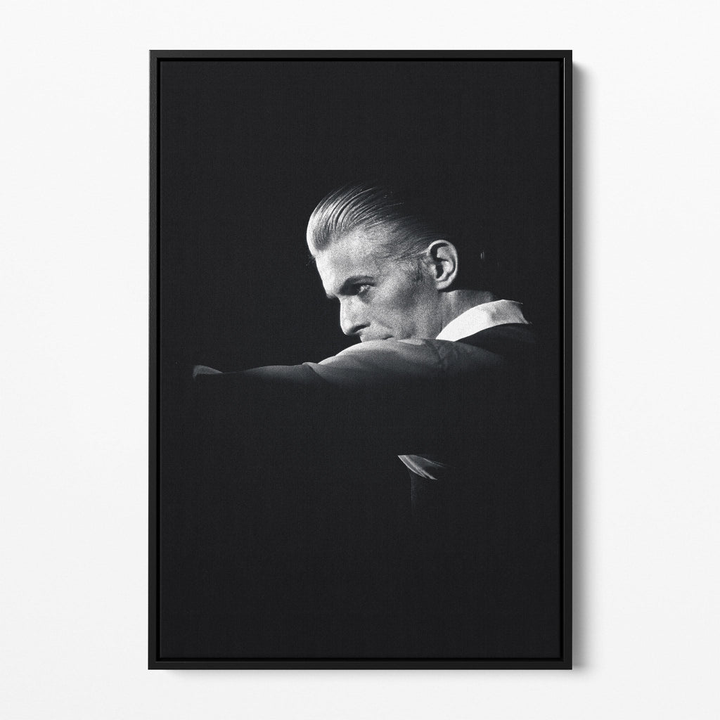 Front view of the David Bowie 1976 black and white canvas in a sleek black floating frame.