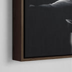 Corner close-up showing the rich grain and joinery of the dark walnut floating canvas frame.