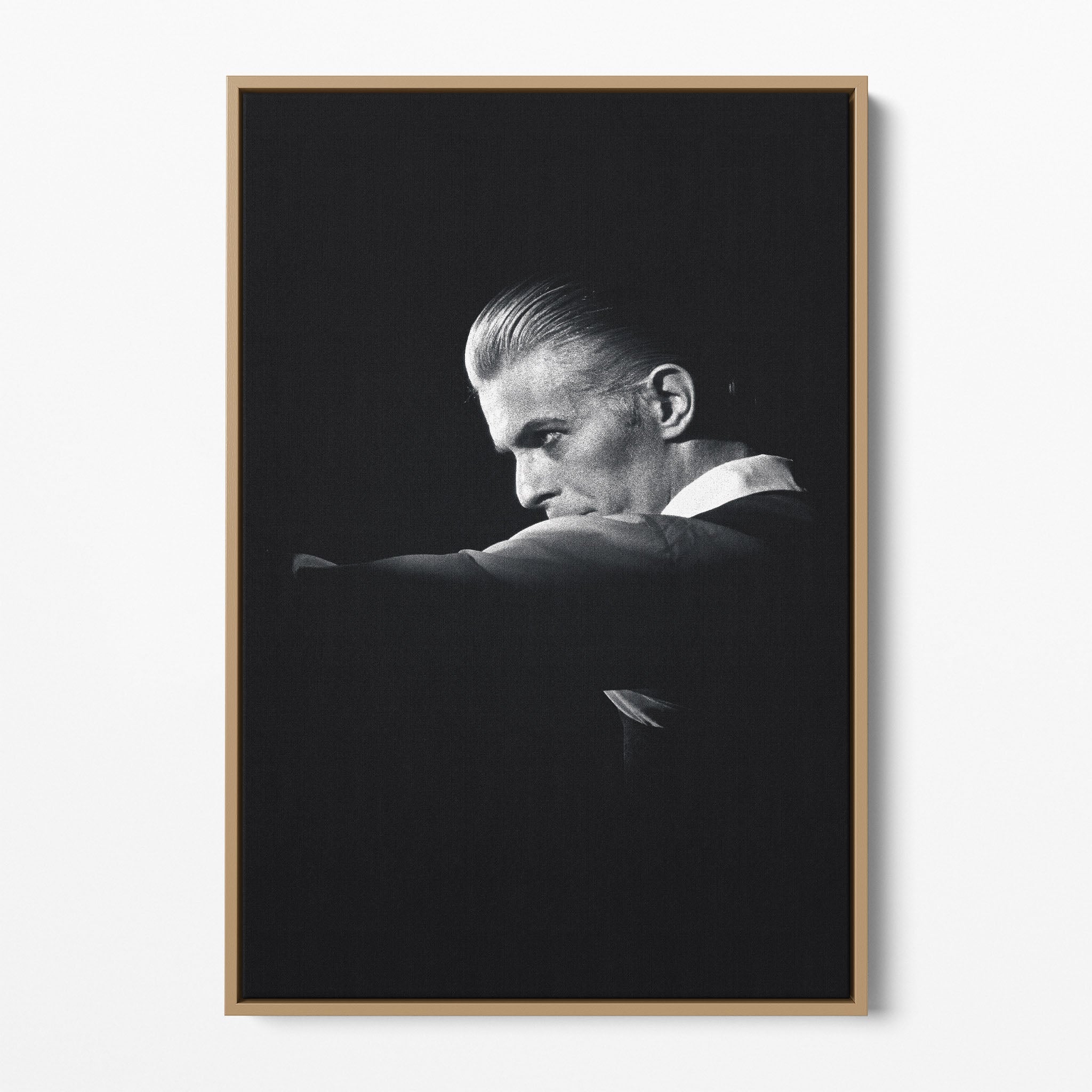 Front display of the David Bowie 1976 black and white canvas in a premium natural wood floating frame.