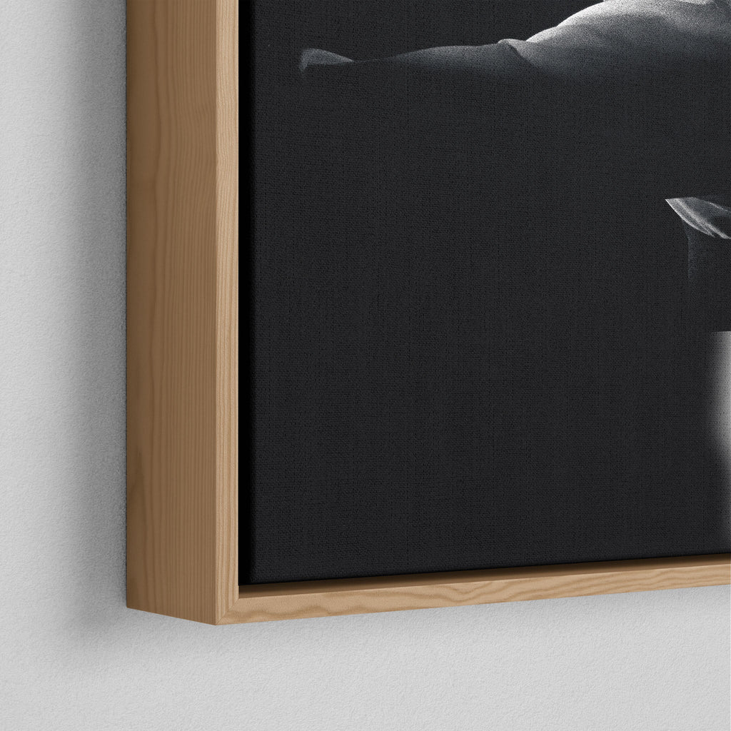 Corner close-up of the floating gap and grain texture of the natural wood canvas frame.