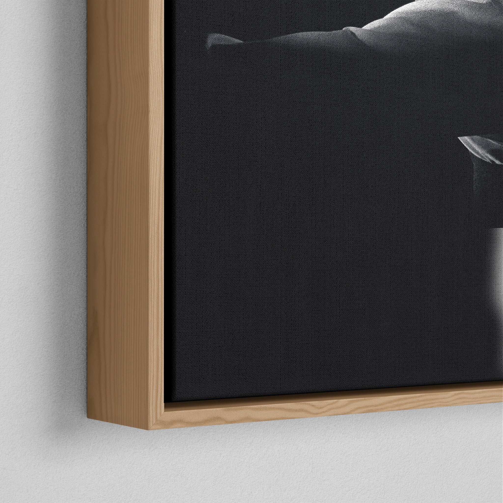 Corner close-up of the floating gap and grain texture of the natural wood canvas frame.