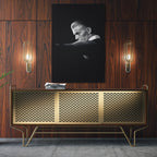 Sleek aluminum black and white metal print of David Bowie displayed over a mid-century modern credenza.