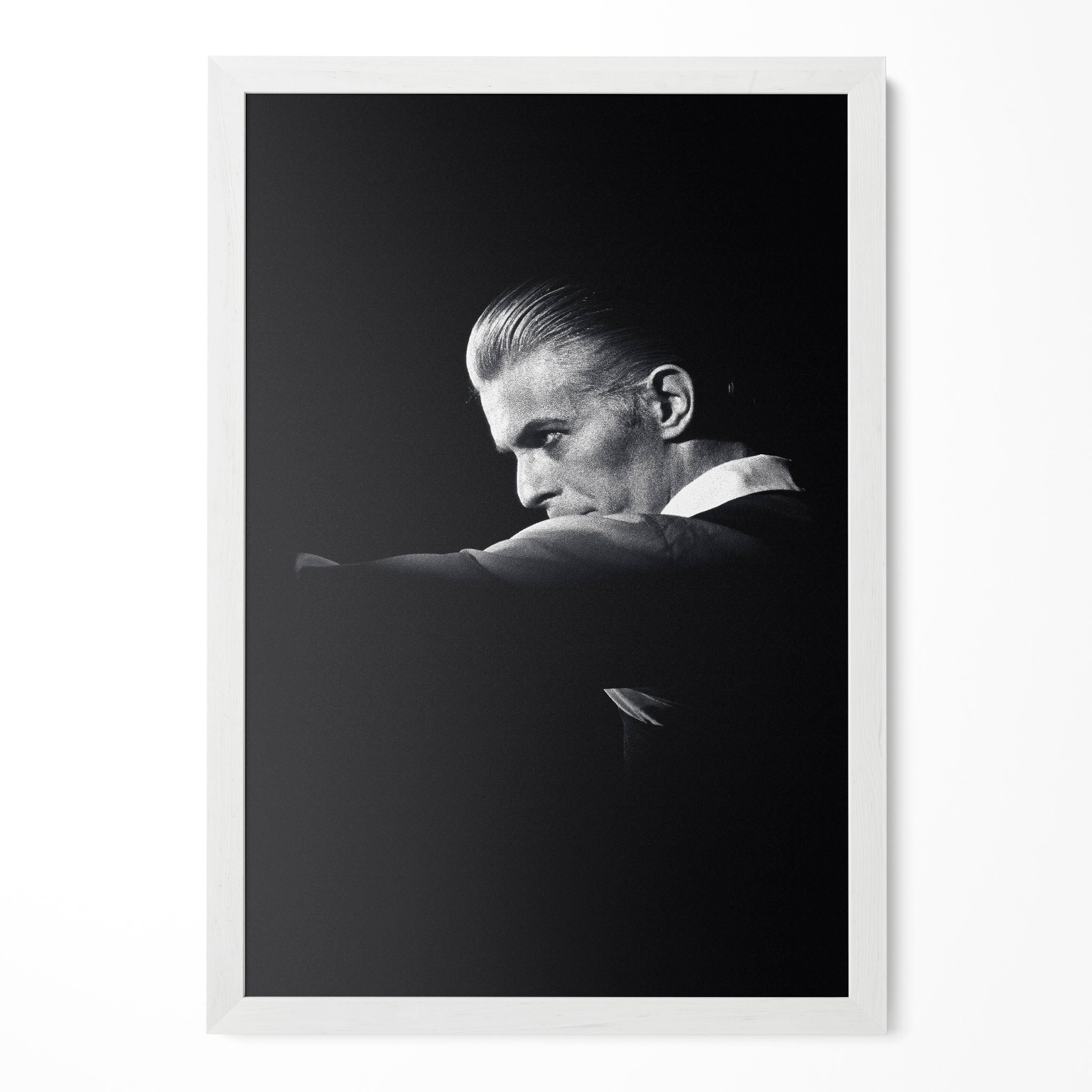 David Bowie 1976 Rotterdam black and white poster in a modern minimalist white wooden frame by POSTEREVER.