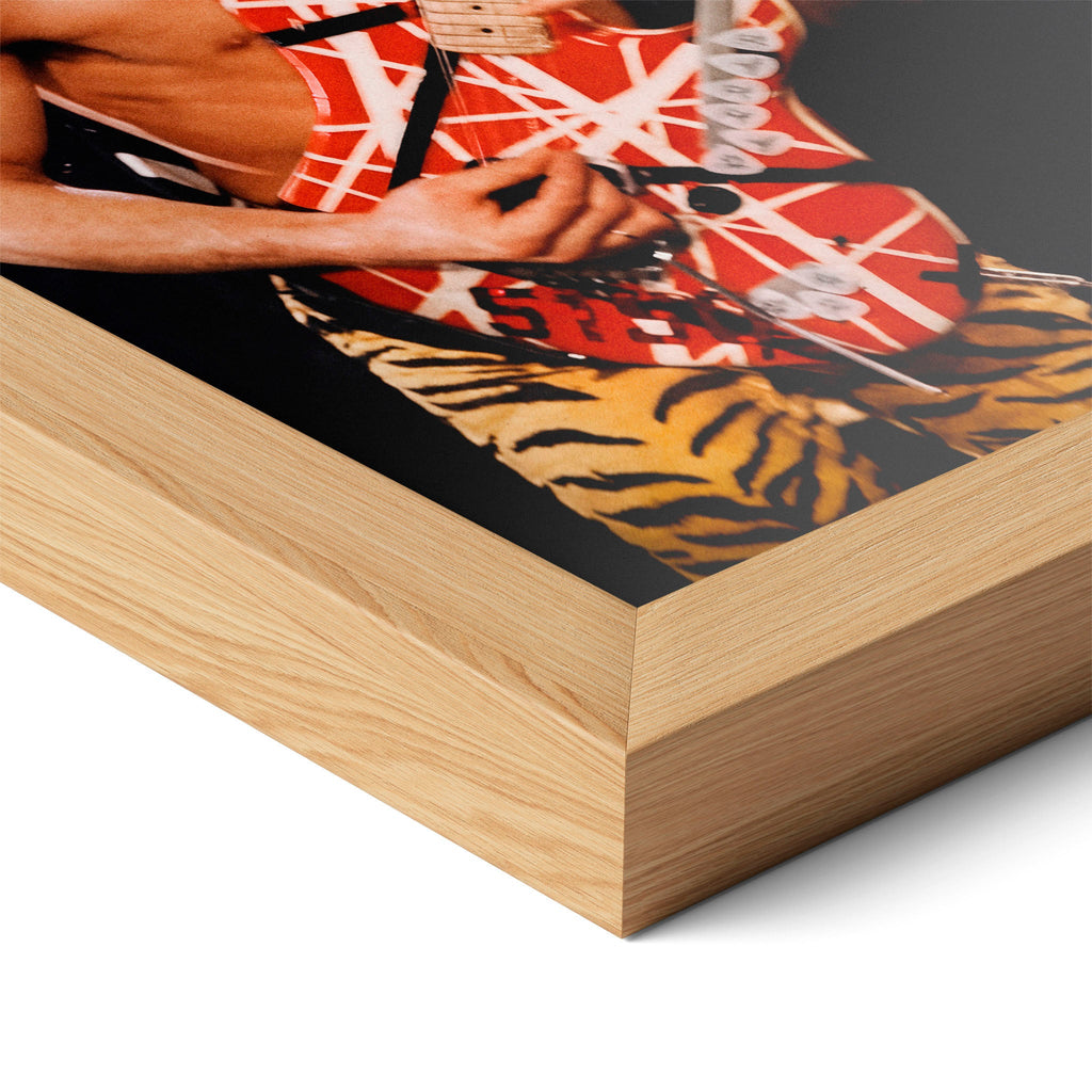 Corner close-up highlighting the natural oak finish of the framed Eddie Van Halen 1984 poster.