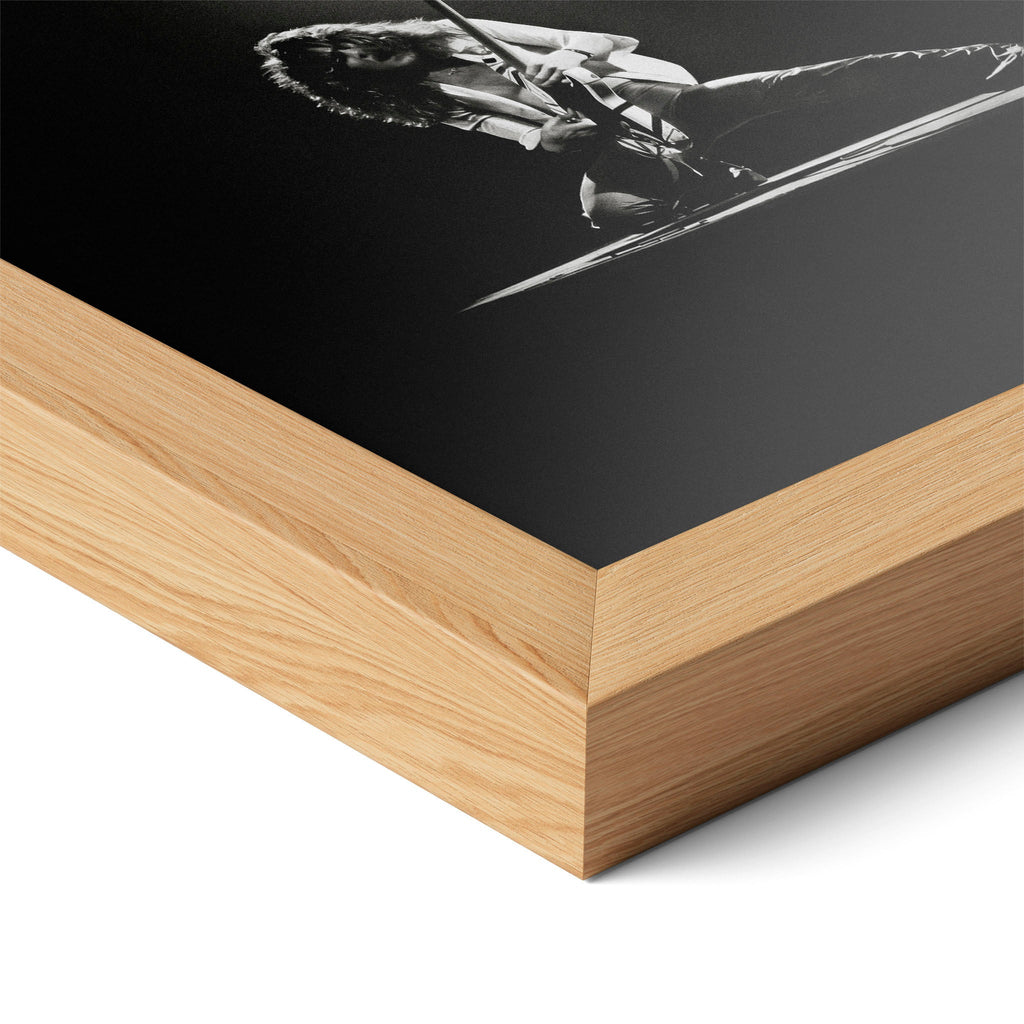 Corner close-up highlighting the natural oak finish of the framed Eddie Van Halen 1978 black and white poster.