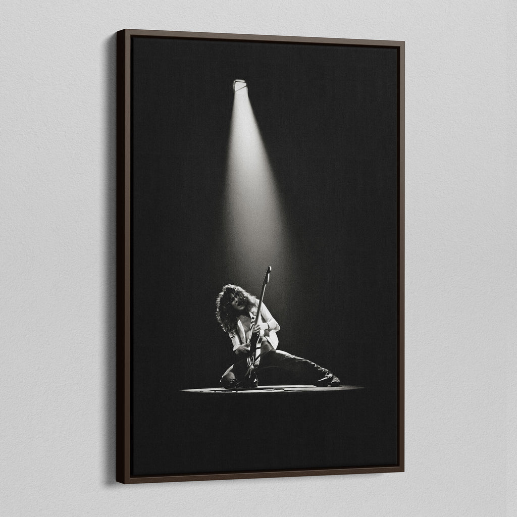 Angled view of the Eddie Van Halen 1978 black and white canvas in a sophisticated dark walnut floating frame.