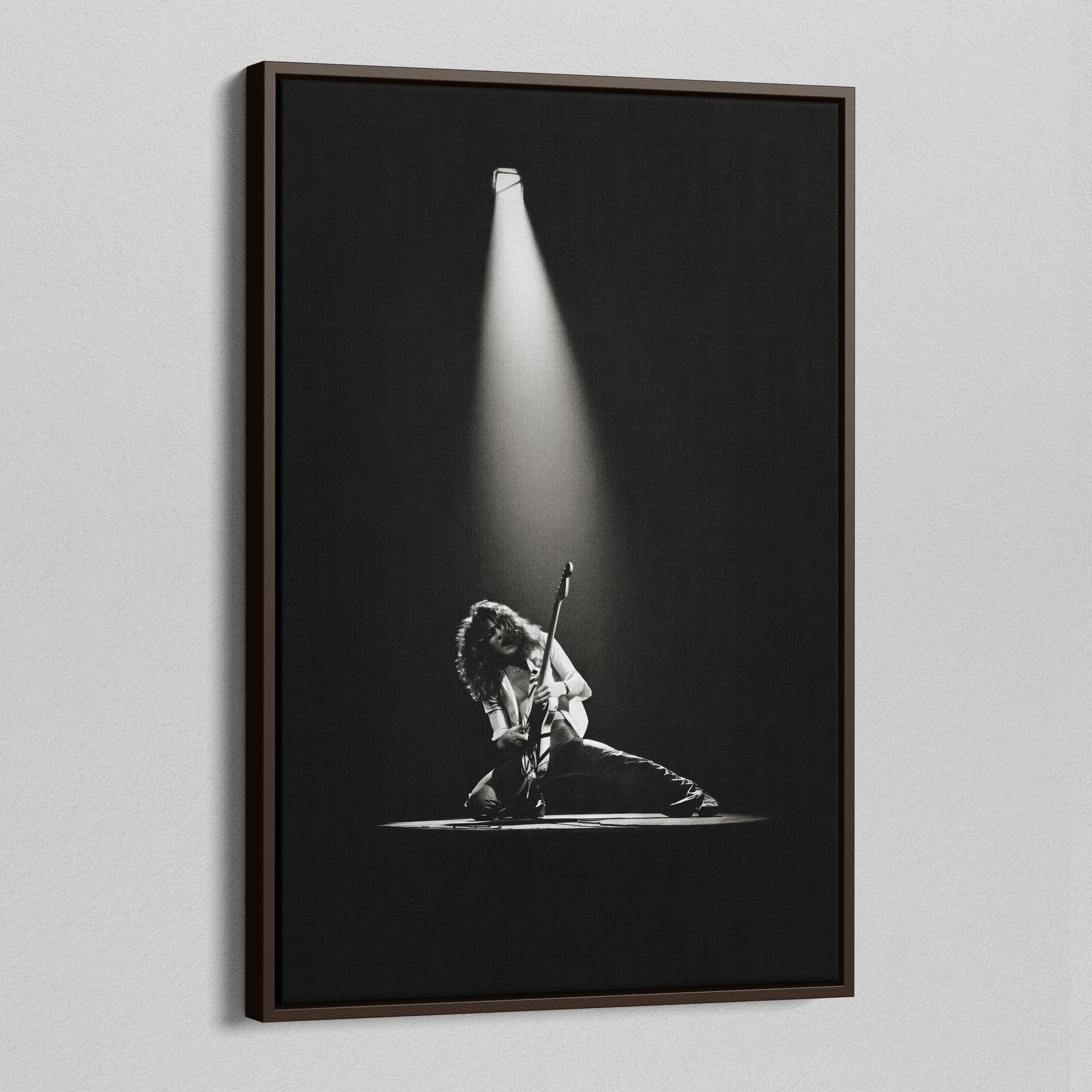 Angled view of the Eddie Van Halen 1978 black and white canvas in a sophisticated dark walnut floating frame.