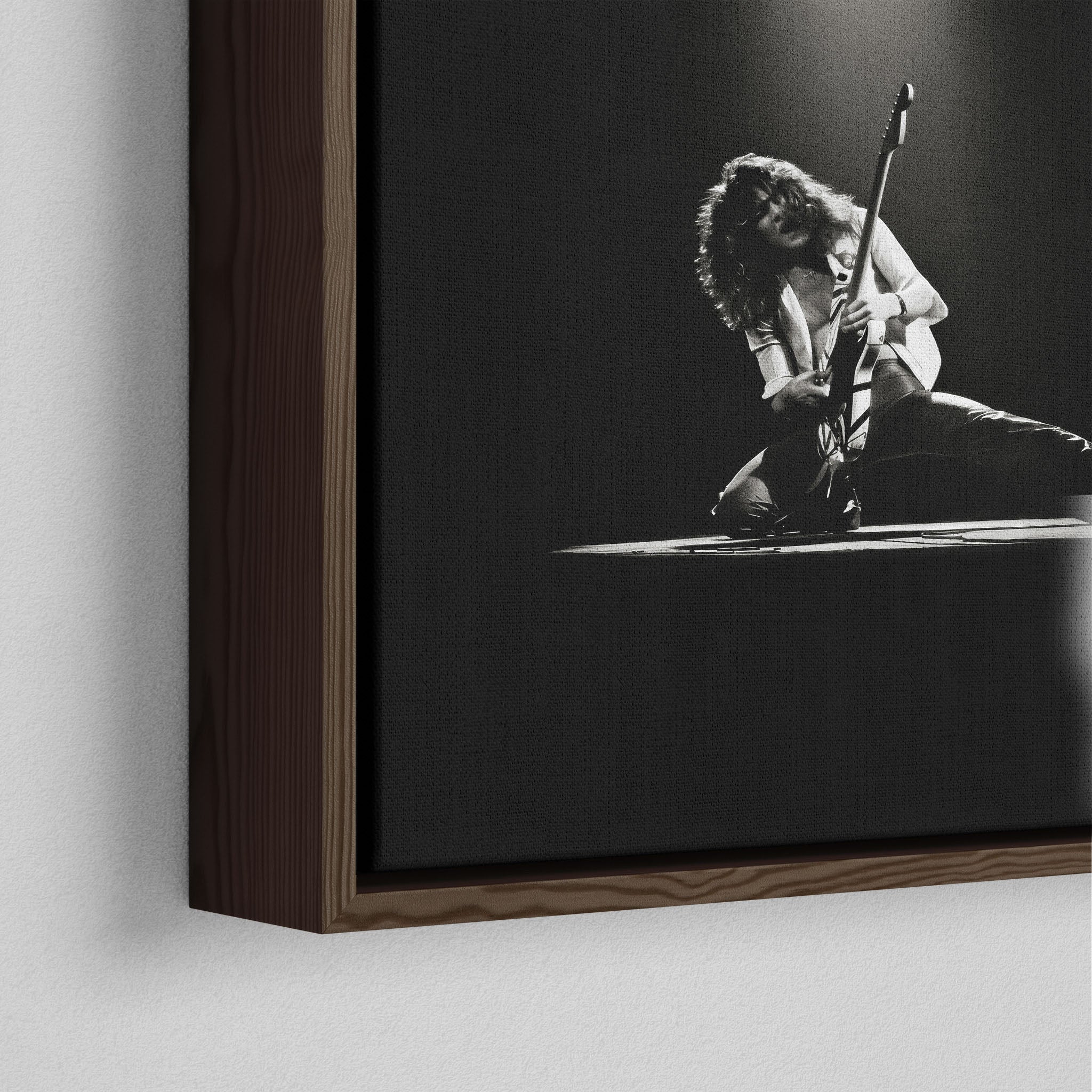 Corner close-up showing the rich grain and joinery of the dark walnut floating canvas frame.