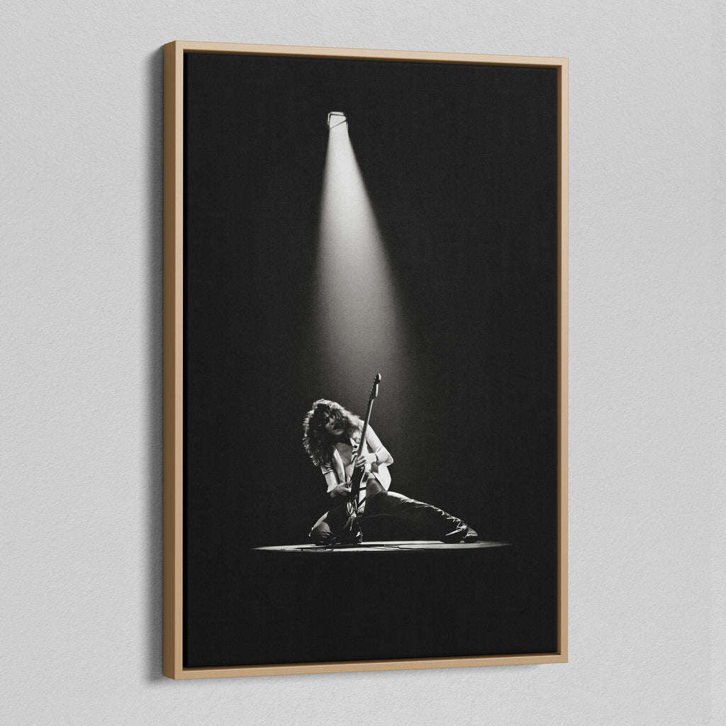 Angled view of the black and white canvas in a modern natural oak wood floating frame.