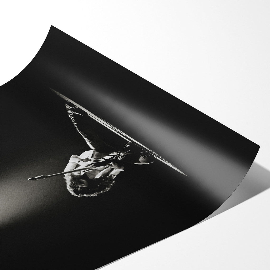 Angled close-up of the unframed premium matte black and white Eddie Van Halen 1978 Rainbow Theatre poster print.