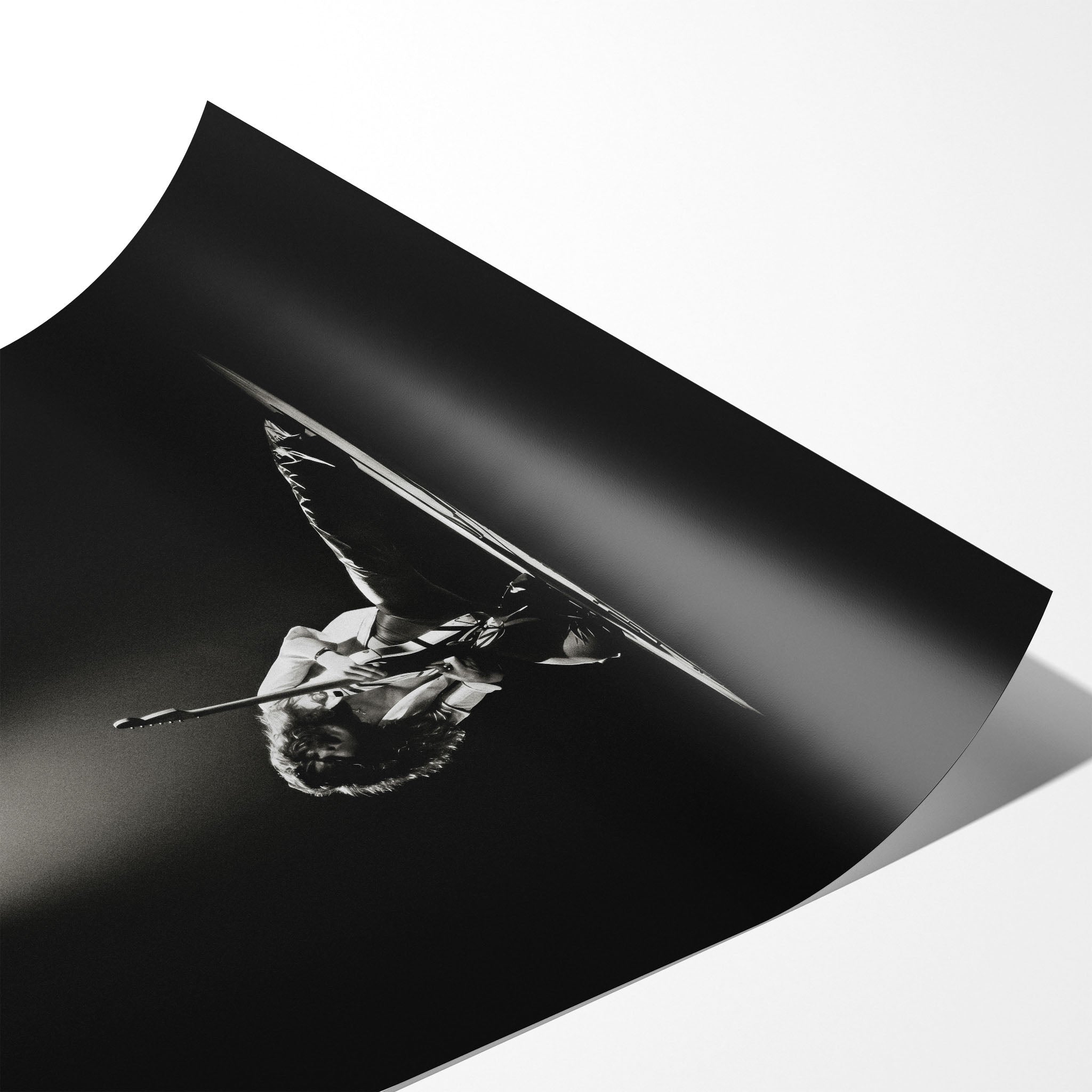 Angled close-up of the unframed premium matte black and white Eddie Van Halen 1978 Rainbow Theatre poster print.