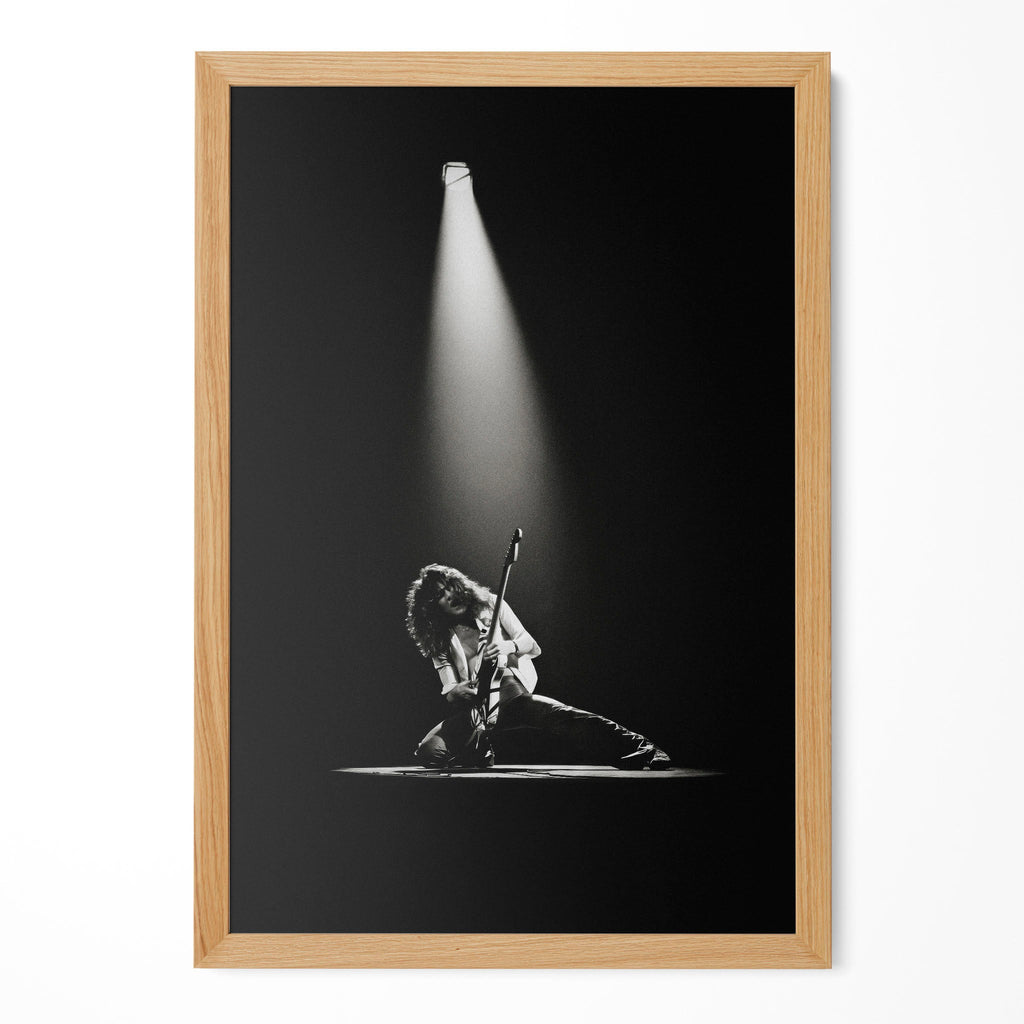 Eddie Van Halen 1978 live black and white guitar poster in a premium natural oak wood frame by POSTEREVER.