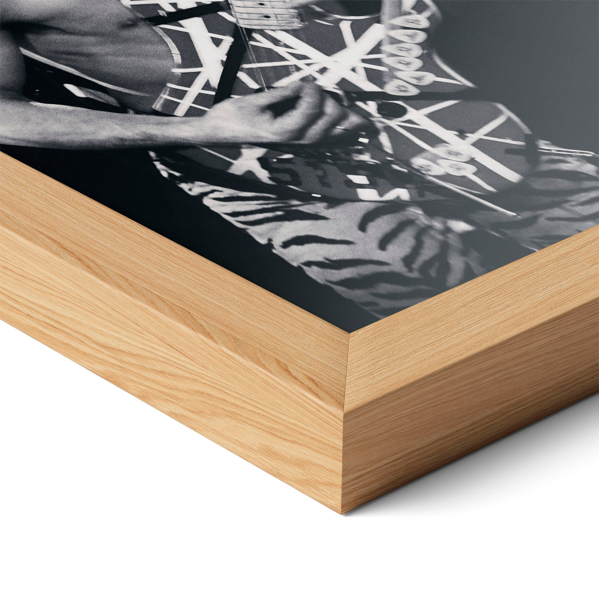 Corner close-up highlighting the natural oak finish of the framed Eddie Van Halen 1984 black and white poster.