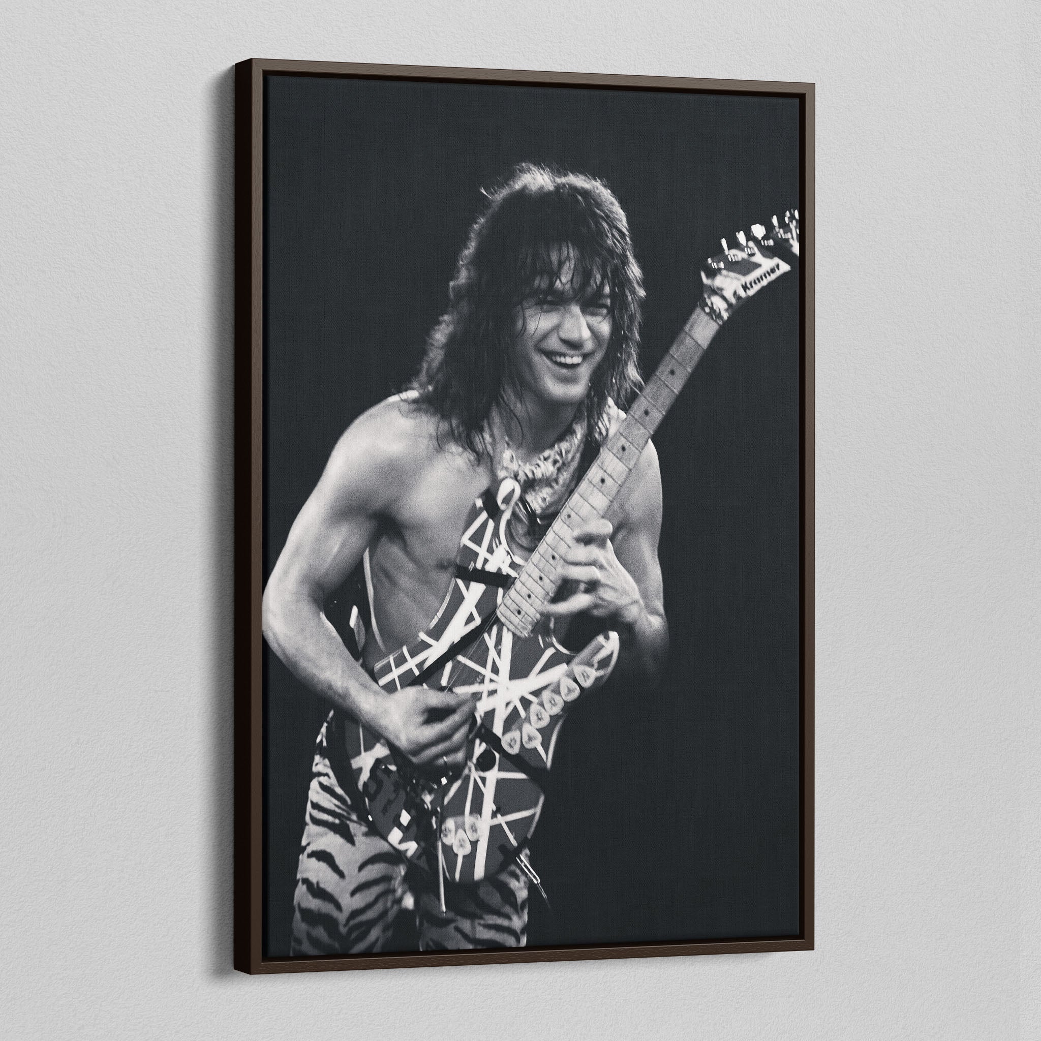 Angled view of the Eddie Van Halen 1984 black and white canvas in a sophisticated dark walnut floating frame.