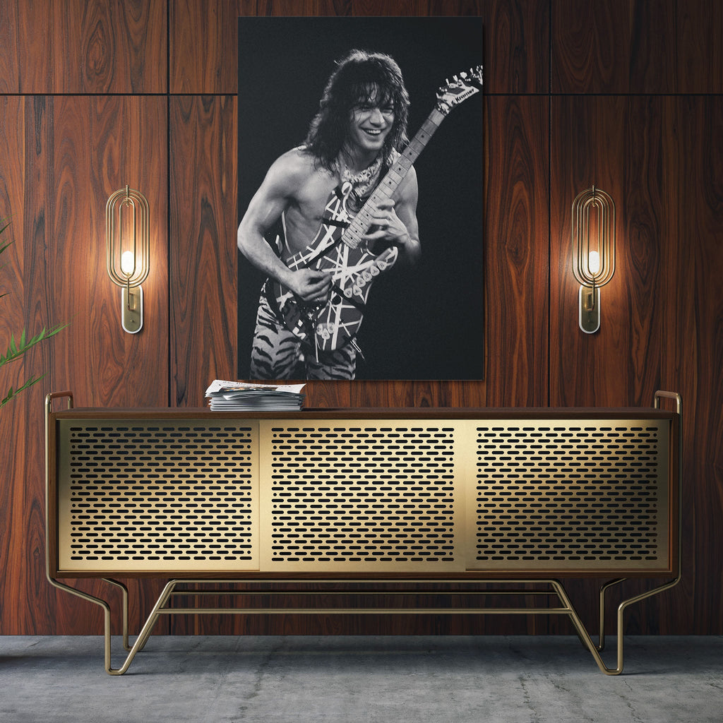 Sleek aluminum black and white metal print of Eddie Van Halen displayed over a mid-century modern credenza.