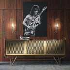 Sleek aluminum black and white metal print of Eddie Van Halen displayed over a mid-century modern credenza.