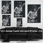 Eddie Van Halen 1984 Cow Palace black and white wall art size comparison chart shown above an average 90-inch three-seater sofa.