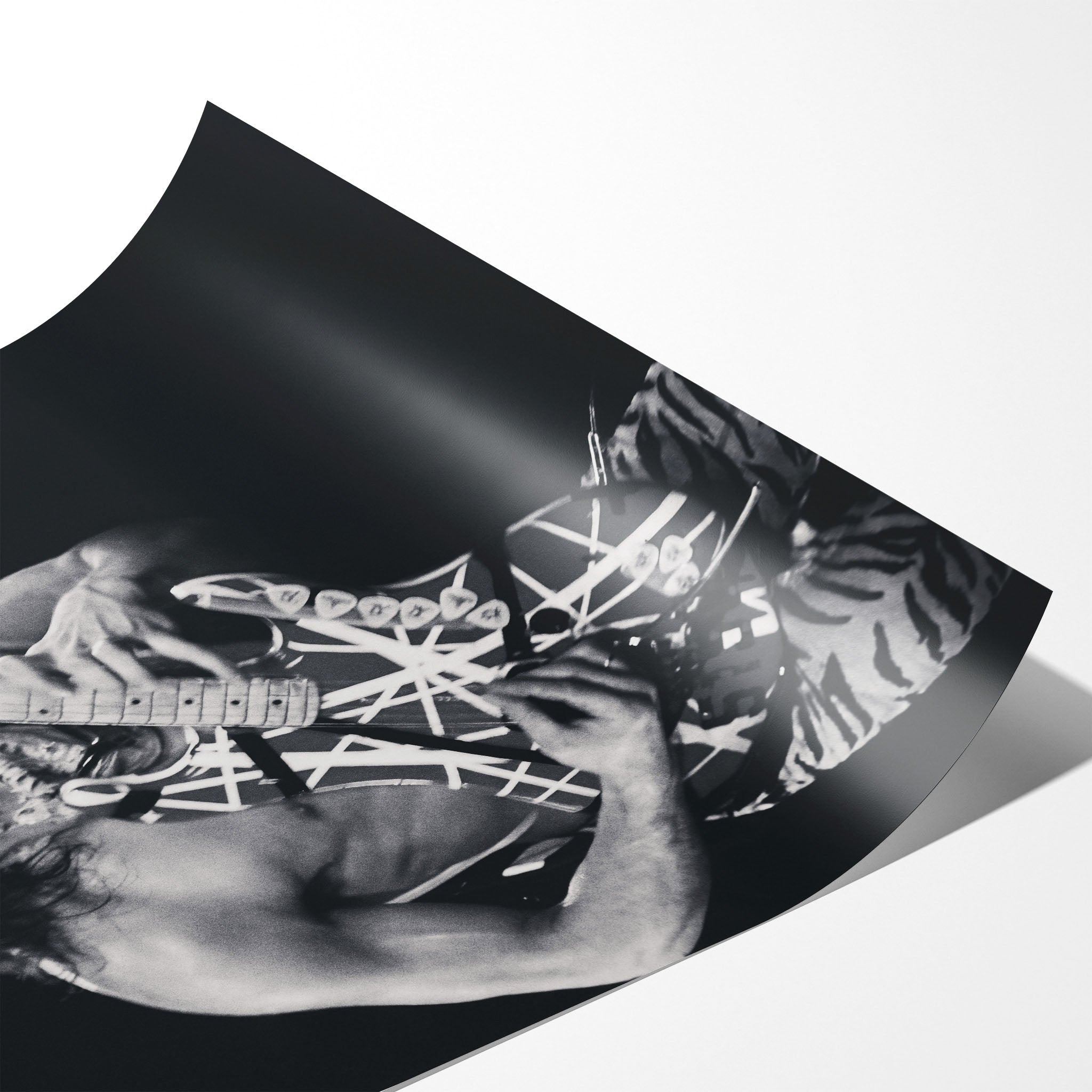 Angled close-up of the unframed premium matte black and white Eddie Van Halen 1984 Cow Palace poster print.