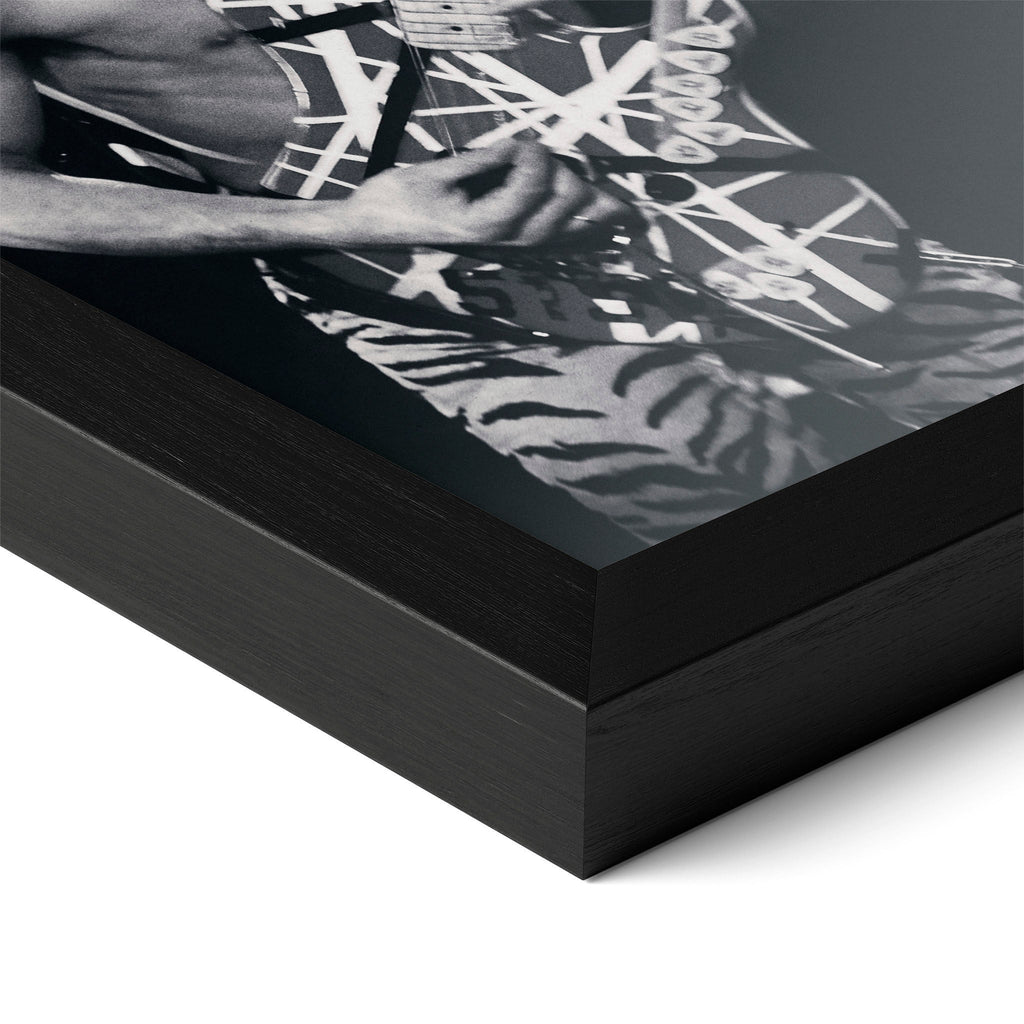 Detailed corner close-up of the premium black wooden frame holding the Eddie Van Halen 1984 black and white rock poster.