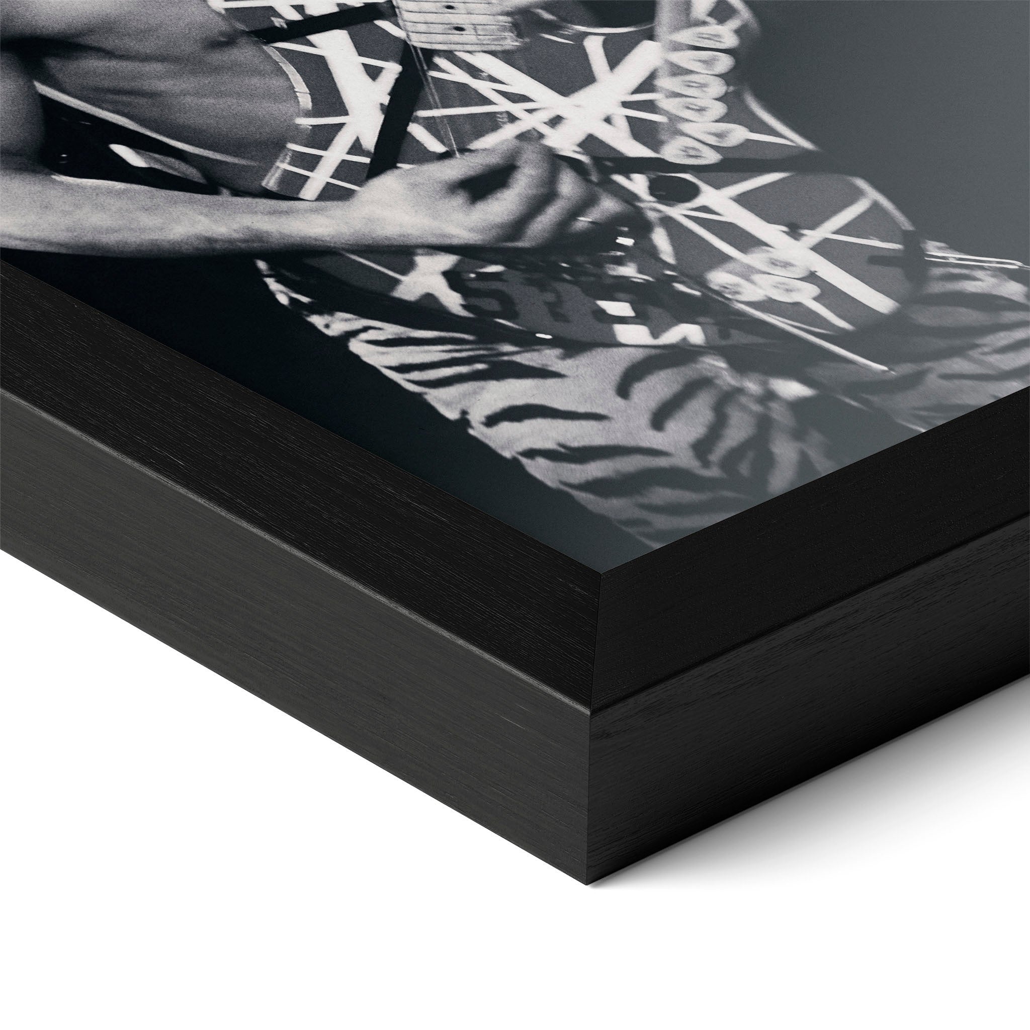 Detailed corner close-up of the premium black wooden frame holding the Eddie Van Halen 1984 black and white rock poster.