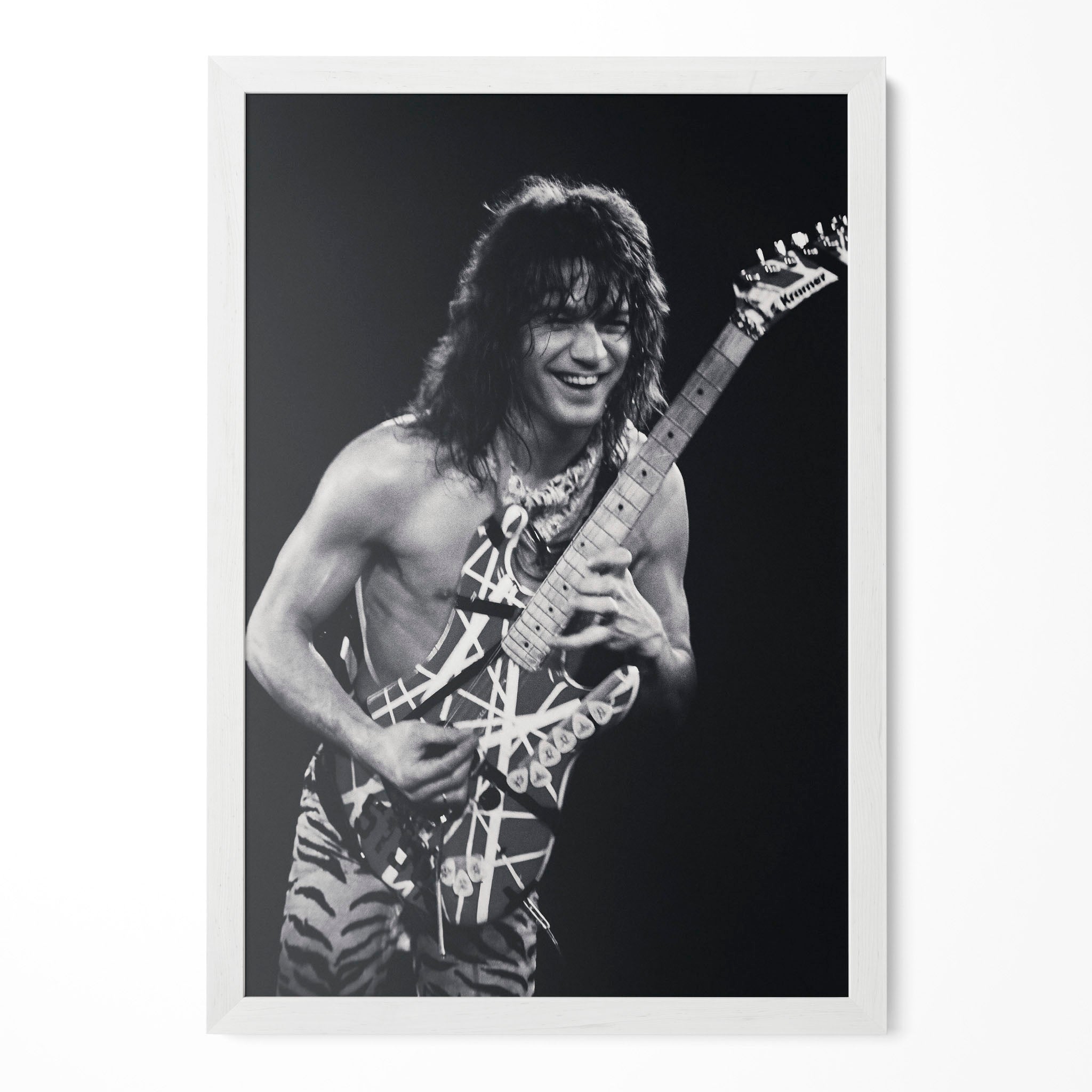 Eddie Van Halen 1984 Cow Palace black and white poster in a modern minimalist white wooden frame by POSTEREVER.